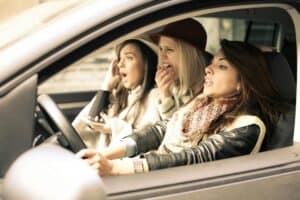 Three women about to get into a rideshare accident